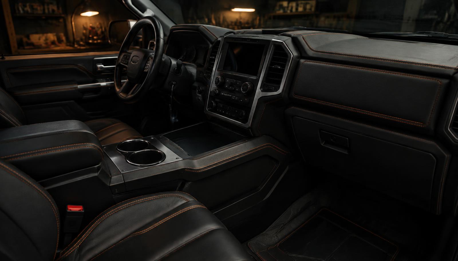 Custom truck cab interior with fabricated center console and stitched trim panels